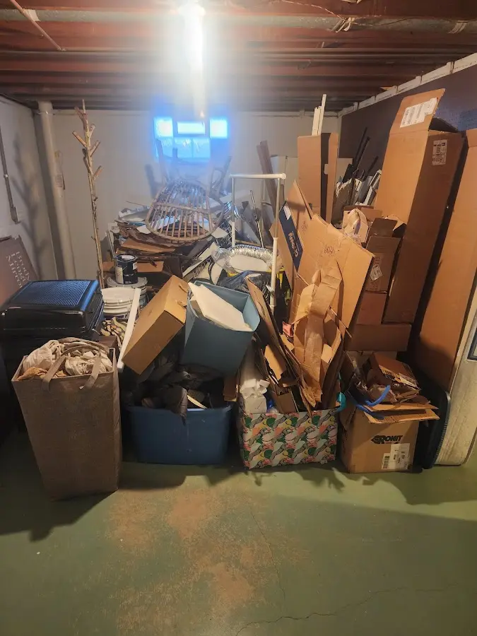 Roll-off dumpster container at job site for 2 Yard Dumpster Rental in Brookline